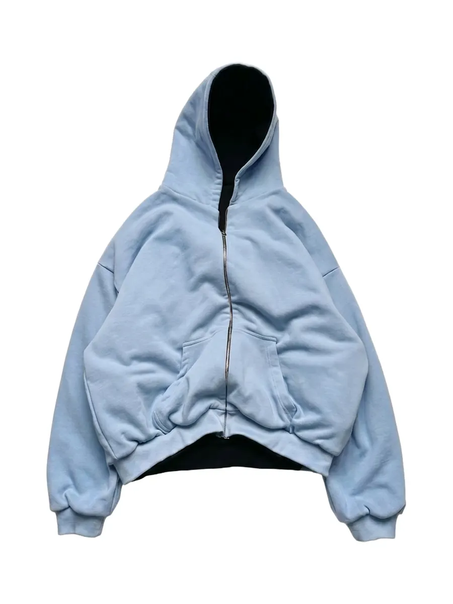 Oversized baby-blue zip hoodie laid flat
